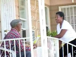 A volunteer precinct leader with ALLERT speaks to a voter